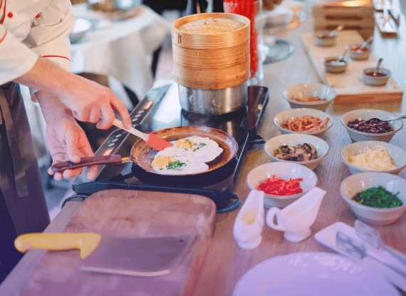 Person cooking on induction plate